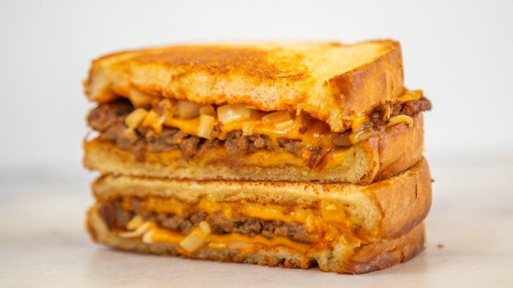 Patty Melt · Grilled onions, seasoned plant-based patty, smoked house vegan Swiss cheese, vegan American cheddar cheese, all between two slices of toasted vegan sourdough bread.