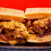 Original Chicken And Waffle Sandwich · Our famous chicken and waffle sandwich comes with chicken breast dipped in syrup with bacon ...