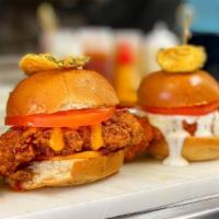 3 Chicken Sliders · Crispy tender chicken tossed in one of our delicious sauces in between a brioche bun topped ...