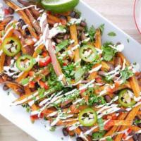 Loaded Sweet Potato Fries · Cheese, Bacon, Green Onions with a side of Sour Cream