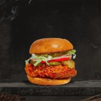 Hot Shot Fried Chicken Sandwich · Vegan crispy chicken tenders tossed in spicy chili oil, peri peri seasoning, lettuce, pickle...