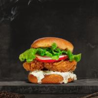 Crispy Cluck Sandwich · Vegan crispy chicken tenders with lettuce and pickles, on a grilled brioche bun with house c...