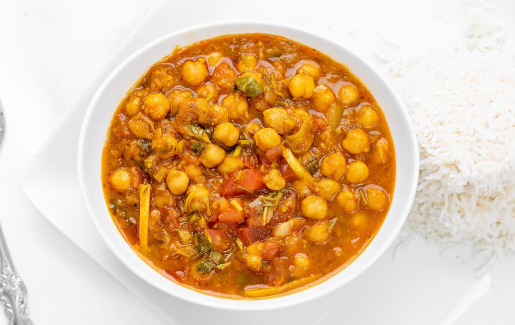 Chana Masala · Chickpeas cooked with onion sauce and tomato sauce.