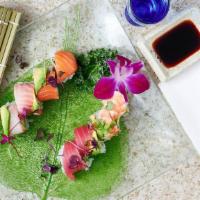 Rainbow Roll · Shrimp, white fish, yellowtail, tuna and salmon, wrapped around kani and avocado.
