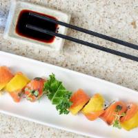 Sunshine Roll · Kani, cucumber, avocado inside topped with salmon and mango.