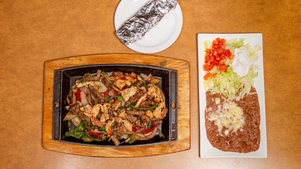 Shrimp Fajitas · Bell peppers and onions served with, sour cream, tree flour tortillas and choice of rice or beans.
