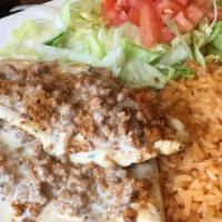 Chori Pollo · Grilled chicken and chorizo topped with Juan's special cheese sauce, lettuce and tomatoes, s...