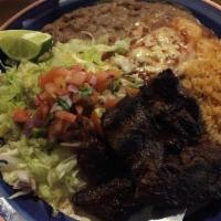 Carne Asada · Marinated hanger steak served with one cheese enchilada, beans, rice and tortillas.