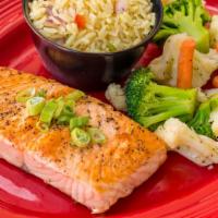 Grilled Salmon · Eight ounces salmon grilled or blackened. Served with two sides