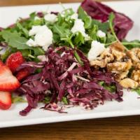 Walnut Salad · Peppery arugula and radicchio with Texas goat cheese, strawberries, and toasted walnuts in w...