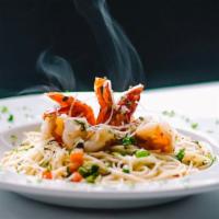 Shrimp Scampi · Shrimp Sautéed in Garlic Butter with Roma Tomatoes, Green Onions, over Angel Hair Pasta in L...