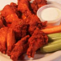 Wolfies Bone-In Wings · Bone-in jumbo wings! Add ranch, blue cheese, carrots, or celery for an additional up charge!