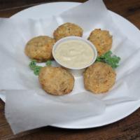 Boudin Balls · Five boudin balls battered & deep fried, served with our
own special dipping sauce.
