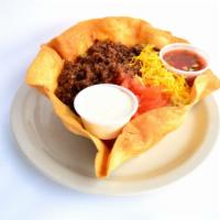 Taco Salad · Your choice of chicken or seasoned ground beef, refried beans, lettuce, tomatoes, cheese and...