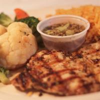 Wolfies Grilled Chicken Breast · Grilled chicken breast marinated in a vinaigrette,served with rice and mixed veggies.