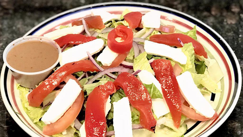 Caprese Salad · Red onion, roasted pepper, fresh mozzarella, lettuce, tomato.