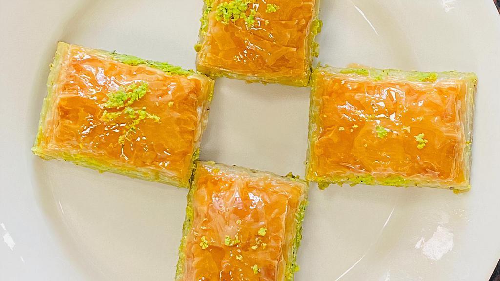 Baklava · Rich sweet pastry made of layers of filo filled with chopped walnut and sweetened and held together with homemade honey. Served as 4 pieces on a plate or to go.