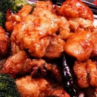 General Tso'S Chicken · Tender pieces of chicken, lightly battered in lotus flour, broccoli on the side. Diced chill...