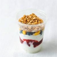 Yogurt Parfait. · Individual cup of Greek vanilla yogurt topped with fresh berries and granola