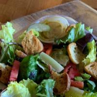 House Salad · Mixed greens, tomato, cucumber, croutons, choice of dressing.
