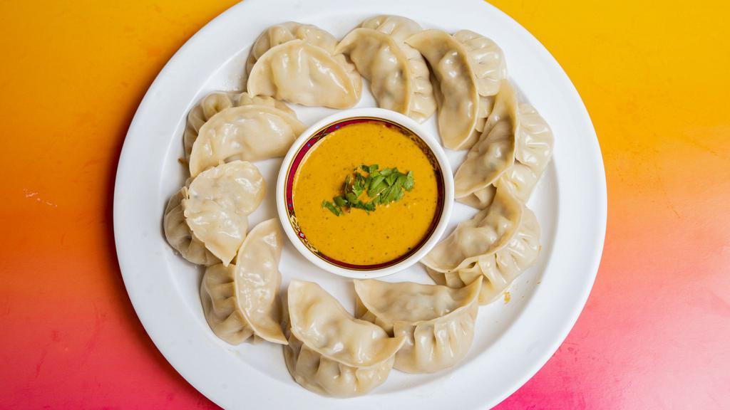Chicken Momos · Classic Momo: Steamed dumpling. Served with our secret momo sauce. 
Jhol Momo: Steamed dumpling. Served with jhol achar (pickling soup).
Chili Momo: Sautéed dumplings, tomato, green peppers with tomato sauce & spices.