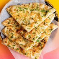 Garlic Naan · Our classic naan topped with garlic.