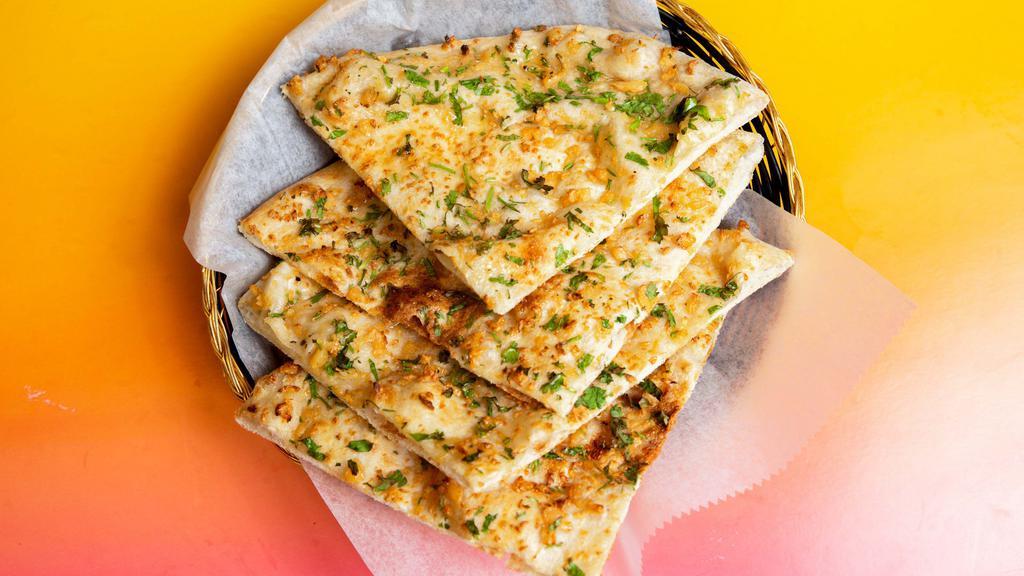 Garlic Naan · Our classic naan topped with garlic.