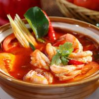 Tom Yum · The most popular hot and sour soup with mushroom, lemongrass, tomato, lime leaves, cilantro ...