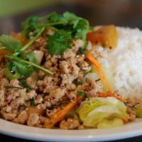 Larb Moo · Grounded pork salad, green onion, cilantro, mint served with Jasmine rice
