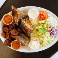 Attieke With Cassava Fish And A Side Of Plantain/Potatoes · Acheke, also spelled attiéké or akyeke, is a dish made from cassava, and is a popular and tr...