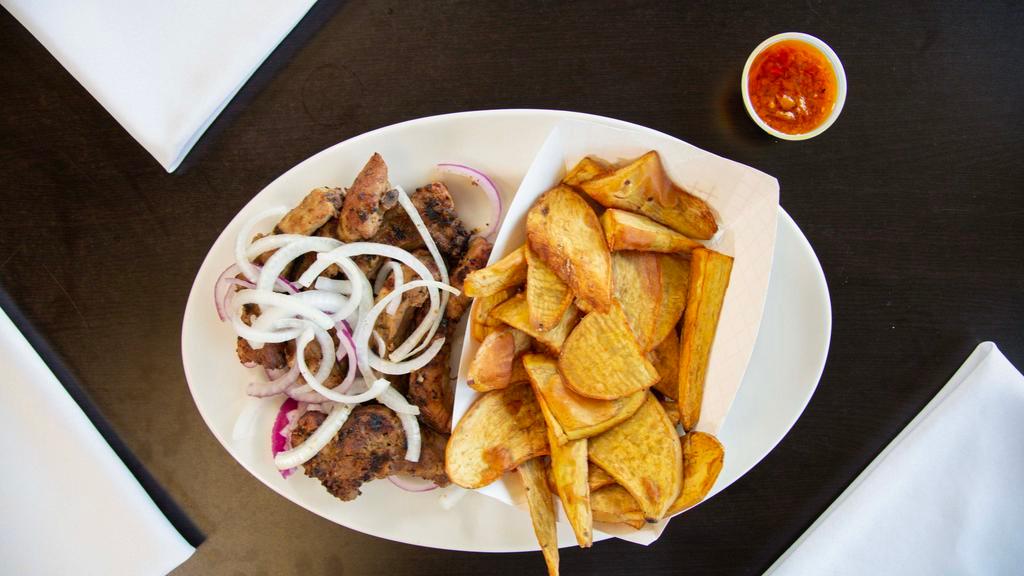 Peanut Butter Ribs With Potatoes · 5 to 6 baby back ribs marinated in our sauce dipped in our peanut butter sauce grilled served with Plantain or Potatoes