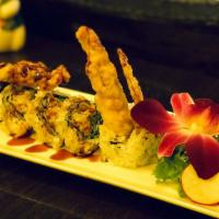Spider Roll · Fried soft shell crab, lettuce with eel sauce and masago