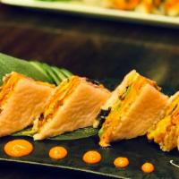 Sushi Sandwich · Spicy tuna, eel, avocado, and masago wrapped with soy paper, topped with spicy mayo and eel ...