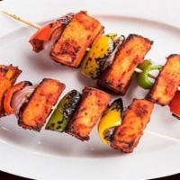 Paneer Tikka · Gluten-Free. Tender pieces of homemade cheese marinated in yogurt with fresh spices, cooked ...