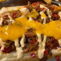 Philly Cheese Dog · Philly steak, bell pepper, onions and cheese. Fries included.
