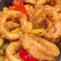 Fried Calamari · Squid rings & tentacles, battered & lightly fried in peppers & oil.