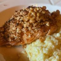 Cashew Crusted Salmon · Pan seared Salmon topped with chopped cashews, served over fig risotto & honey drizzle.