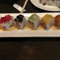 Sexy Girl Roll · Half spicy crunchy tuna and avocado, half spicy crunchy salmon, and mango inside, topped wit...
