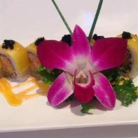 Wild Mango Roll · Spicy crunchy lobster and avocado inside top with slice mango in mango sauce and spicy mayo.