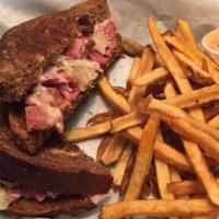 Reuben · This classic is made with our roasted corn beef brisket, Swiss cheese, sauerkraut and Thousa...