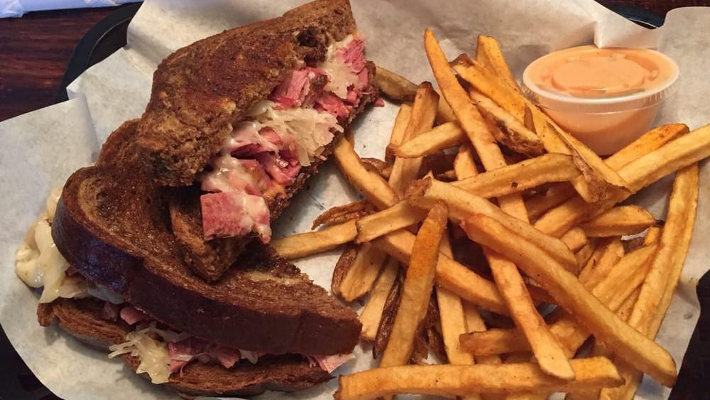 Reuben · This classic is made with our roasted corn beef brisket, Swiss cheese, sauerkraut and Thousand Island dressing on grilled marble rye.