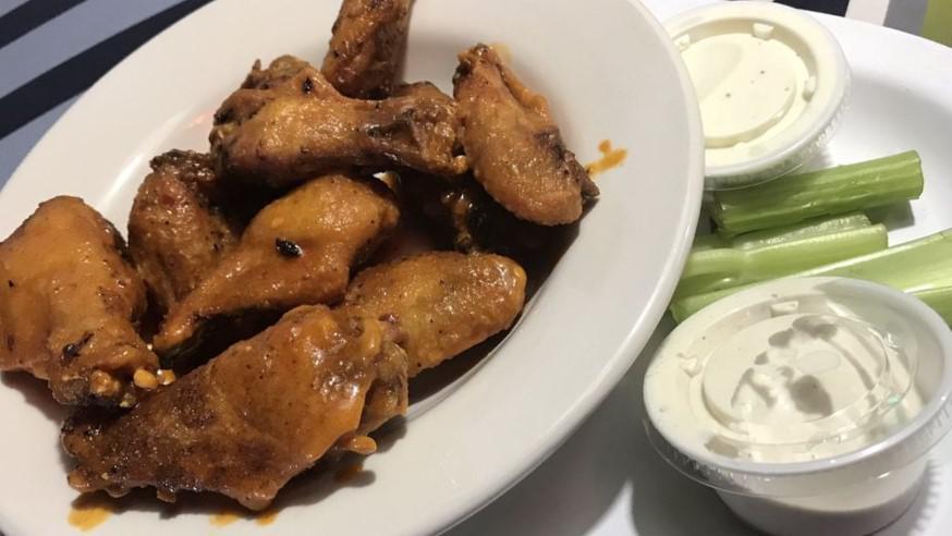 Chicken Wings · 9 Large fresh chicken wings, fried to perfection and basted with your choice of sauce. Served with bleu cheese or ranch dressing and celery.