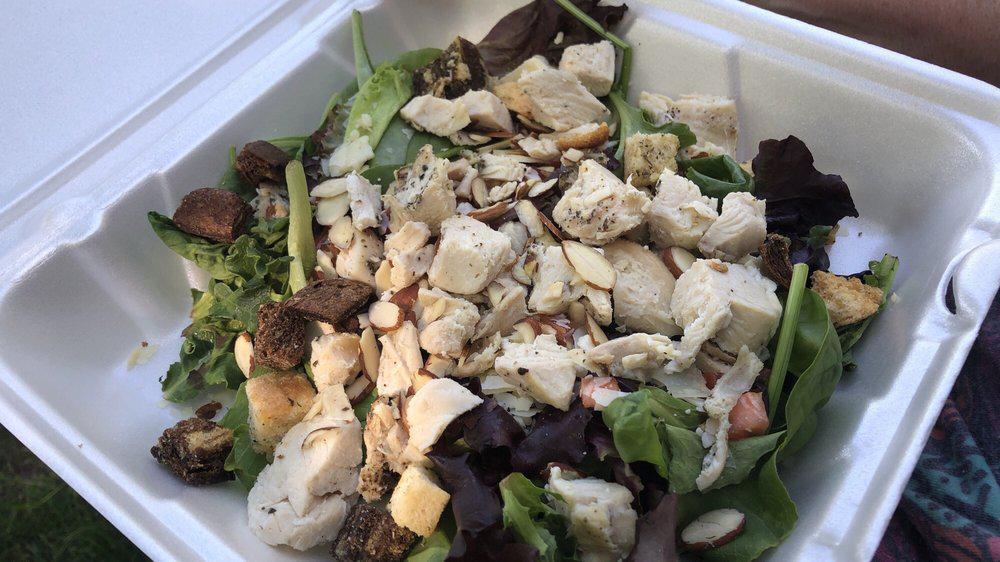 Almond Chicken · Mixed greens, grilled chicken, tomato, almonds, shaved Parmesan, and croutons