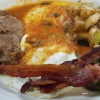 Huevos Rancheros · Two eggs with ranchero sauce, potatoes, beans, and two tortillas.  With a choice of country ...