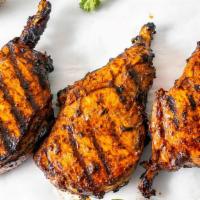 Jerk Bbq Pork Chops · Juicy grilled sweet, and spicy pork chops are marinated overnight in our Tropical Bites sign...