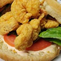 Shrimp Po Boy Sandwich · Our delicious shimp paired with a southern classic; lettuce tomato, remoulade or tartar on a...