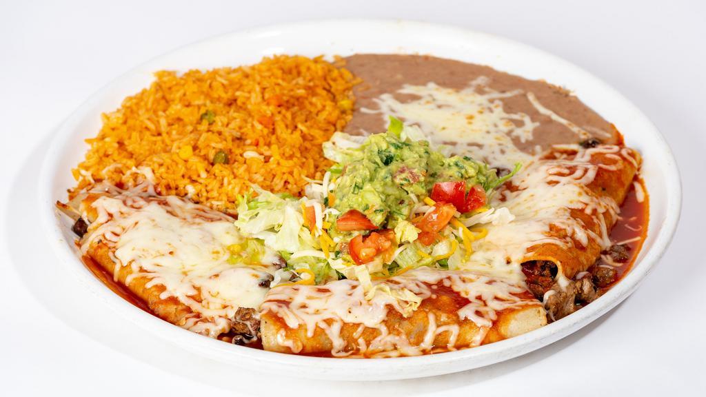 Tacos Supremos · Three soft corn tortillas filled with your choice of one meat, onions & cilantro.Topped with slightly hot sauce & melted cheese. Garnished with lettuce, tomatoes & guacamole. Served with rice & beans.