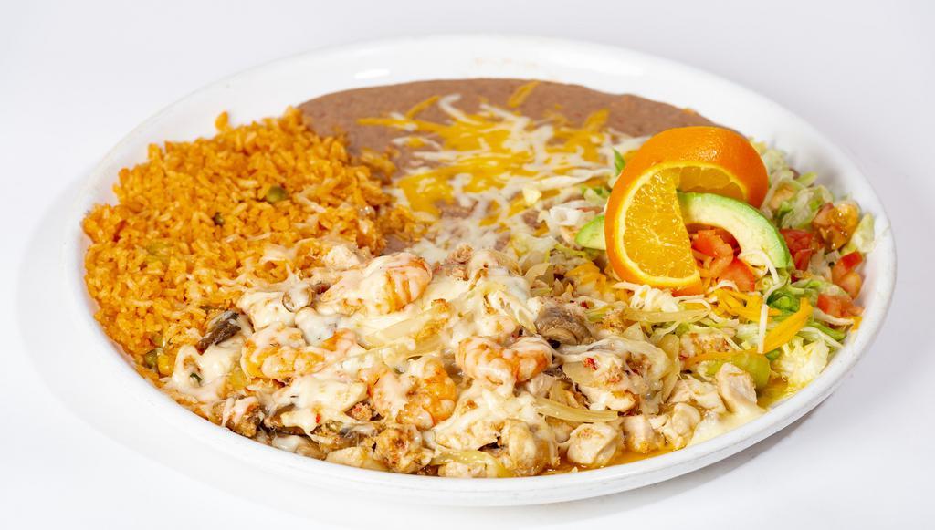 Cancun Platter · Real crab meat, shrimp and chicken sautéed with mushrooms and onions in wine, topped with Monterey jack cheese and then baked. Garnished with lettuce, tomatoes, cheese, a slice of avocado and a slice of orange. Served with rice beans and tortillas.
