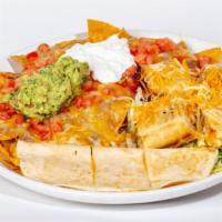 Combo Appetizer · Our combination of nachos, cheese quesadilla and chicken taquitos served with lettuce, tomat...