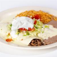 Burritos Mexicanos · Two burritos stuffed with rice, beans and your choice of one meat, steak, pastor marinated p...